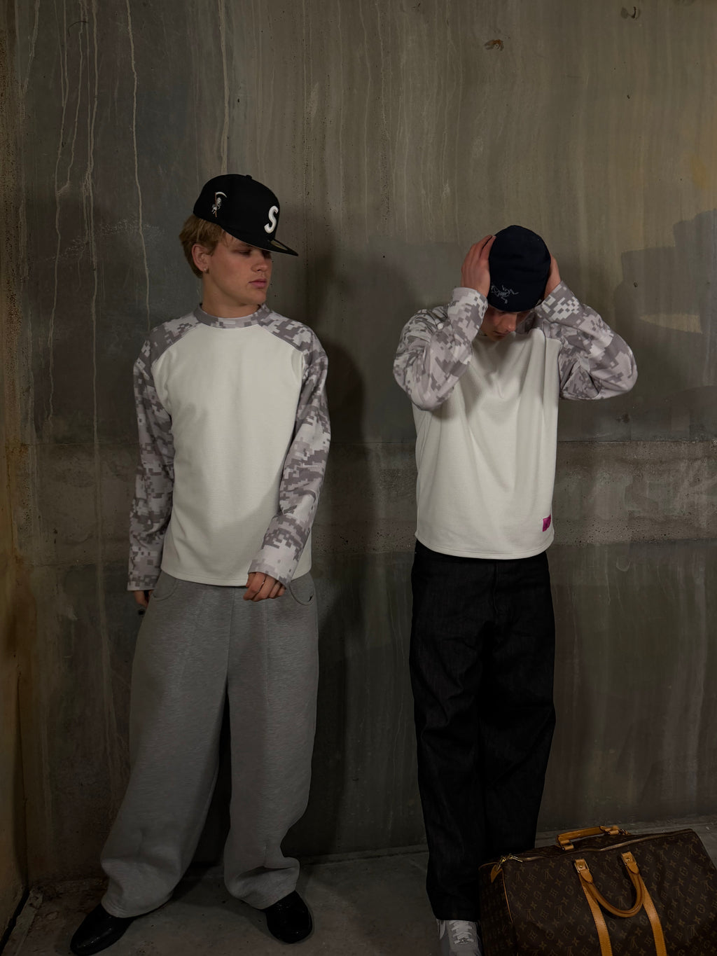 Models wearing digital camo waffle knit long sleeve shirt in urban setting
